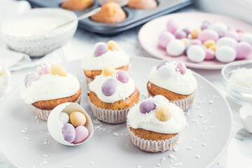 Glazed Easter cupcakes decorated with mini chocolate eggs