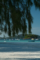 Boats off Cote D'Or in the evening light off the Seychelles.