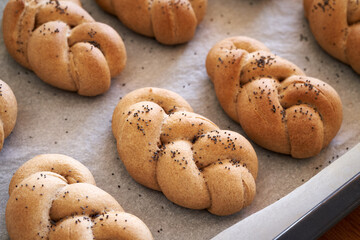 Baked braided bread buns made from whole grain spelt flour
