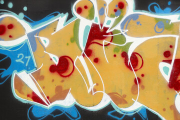 Colorful background of graffiti painting artwork with bright aerosol strips on metal wall. Old...