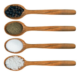 Two wooden spoons with coarse and ground salt. Two wooden spoons with pepper balls and ground....