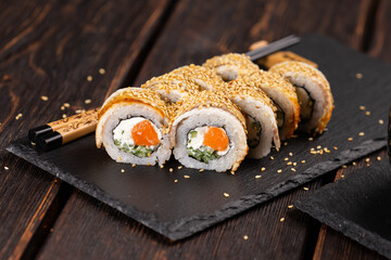 Sushi roll with smoked eel and salmon with cucumber and cheese. Traditional delicious fresh sushi roll set. Sushi menu. Japanese cuisine restaurant. Asian food