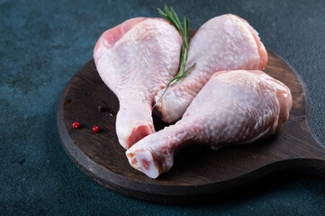 Raw uncooked chicken legs. meat with ingredients for cooking