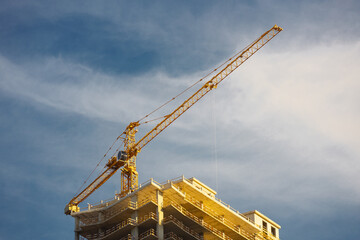 Construction site. Skyscrapper building and cranes.