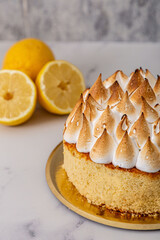 lemon cream and meringue cake on marble background