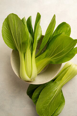 Celery cabbage or peach choi, asian baby salad leaves, top view.