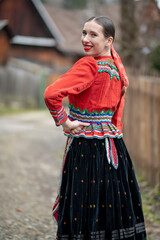 Young beautiful slovak woman in traditional dress. Slovak folklore