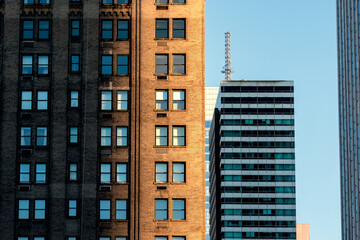 modern building at night in new york condominium apartment windows live house office rental leasing...