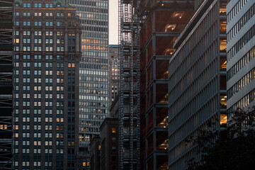 Modern city building architecture apartments. Low angle view of skyscrapers. Looking up perspective. Bottom view of modern skyscrapers in a business district. Cityscape at daylight.	
