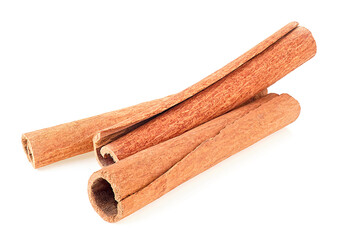 Front view of cinnamon sticks isolated on a white background