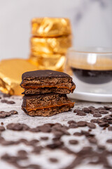 Chocolate alfajor with dulce de leche coffee capsules