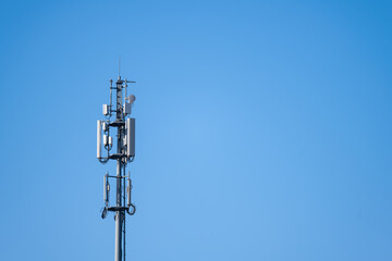 Tall communications tower in a forest.