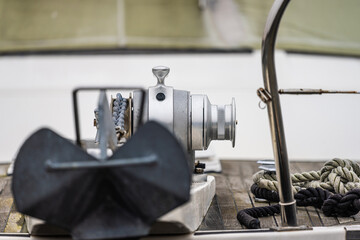 Anchor winch mounted on the bow of a boat.