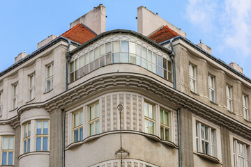 Corner of the house of classical European architecture of the old cozy tourist city. Background with selective focus