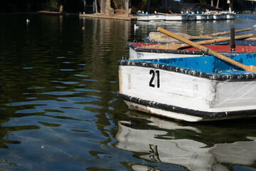 Fototapeta na wymiar Wooden boat in the park pond