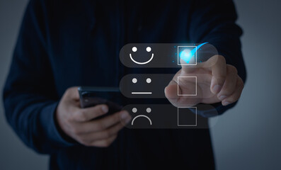 Customer service and Satisfaction concept, Business people touch the virtual screen on the happy Smile face icon to give satisfaction in service. rating very impressed.