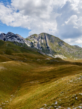 Prutas peak in Durmitor National Park in a summer day with beautiful white clouds in the sky. Montenegro, Europe