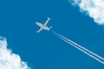 Flying plane among the clouds