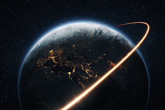 Space shuttle rocket flies with blasts and a light line around the night planet Earth with lights cities. Travel in space, concept. Space satellite flies near the planet earth. Starry space