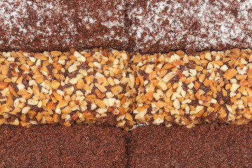 Small chocolate cakes with different sprinkling, fragment close-up