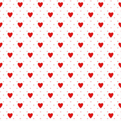 Simple red heart shape and polka dot seamless pattern in diagonal arrangement. Love and romantic theme on white background. Red and white wallpaper.	