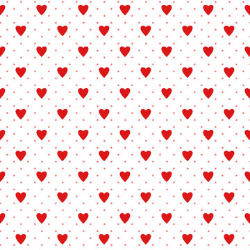 Simple red heart shape and polka dot seamless pattern in diagonal arrangement. Love and romantic theme on white background. Red and white wallpaper.	