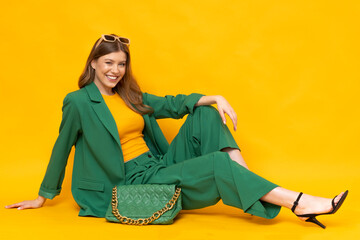 Shocked fashionable model wear in oversize green suit and high heels.  - obrazy, fototapety, plakaty
