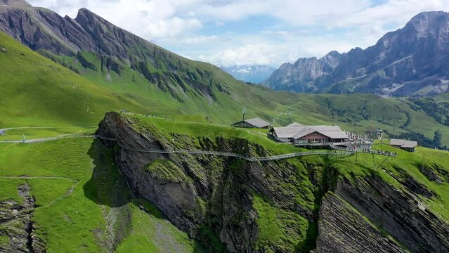 View of Grindelwald First. Popular tourist attraction cliff walk at the Grindelwald First. Swiss alps, Grindelwald valley, Switzerland. First cliff walk in Grindelwald, Switzerland.