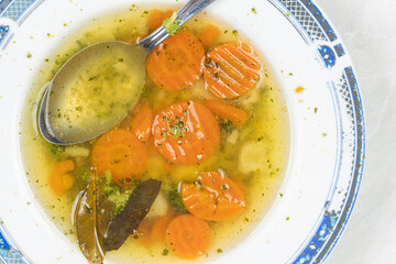 Closeup of carrot and vegetables soup in the plate