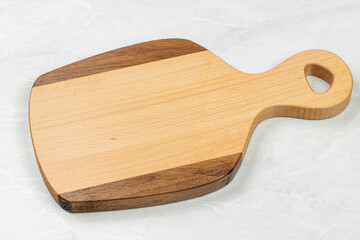 Empty wooden cutting board on the kitchen table