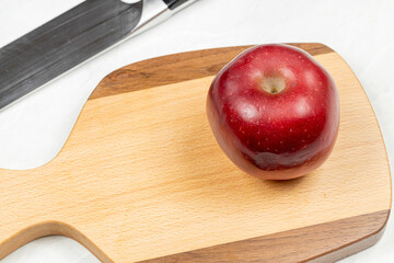 Empty wooden cutting board on the kitchen table