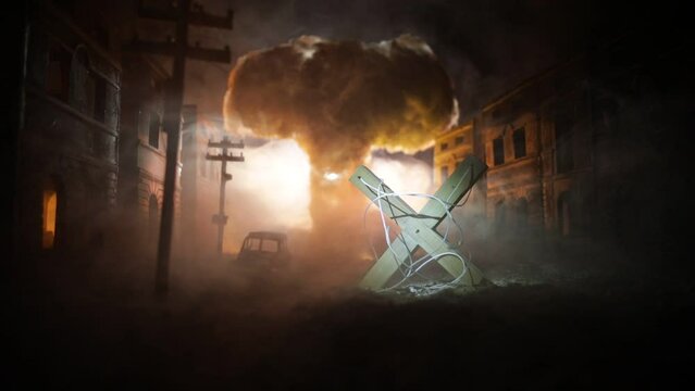 Concept of war or manipulation with global politics. The puppeteer controls soldiers. Night battle scene. Military fighting silhouettes in destroyed city. Selective focus