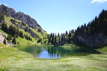 Fototapeta na wymiar The 'Arvouin lake is a lake south of Cornettes de Bise in the Haute-Savoie region of France