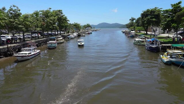 Boat crosses the river in Paraty, Brazil
