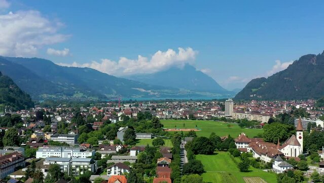 Aerial view over the city of Interlaken in Switzerland. Beautiful view of Interlaken town, Eiger, Monch and Jungfrau mountains and of Lake Thun and Brienz. Interlaken, Bernese Oberland, Switzerland.