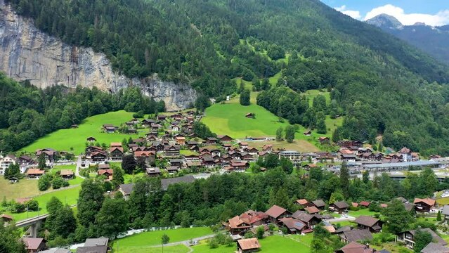 Famous Lauterbrunnen town and Staubbach waterfall, Bernese Oberland, Switzerland, Europe. Lauterbrunnen valley, Village of Lauterbrunnen, the Staubbach Fall, and the Lauterbrunnen Wall in Swiss Alps.