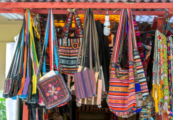 A variety of Peruvian mesa bags, also known as shoulder bags and purse shoulder bags for sale at a store in the Machu Picchu township in Peru.