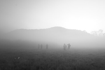 Obraz na płótnie Canvas kids in the foggy hills