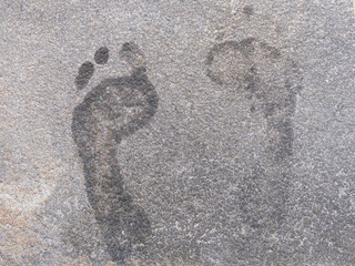 Human footprints in concrete pavement texture