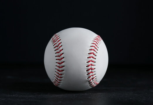 Baseball ball on black background, closeup. Sports game