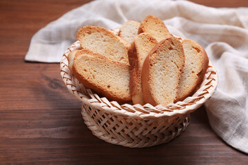 Hard chuck crackers in wicker basket on wooden table