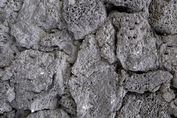 Black concrete stone wall background texture