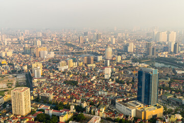 Fototapeta na wymiar Elevated view of a congested city with high rise buildings and tightly packed housing at Hanoi in Vietnam