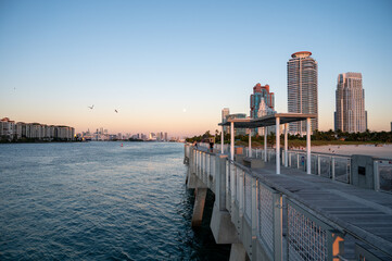South Point Pier and entrance to Port Miami in Miami Beach, Florida in early morning light on clear cloudless sunny day.
