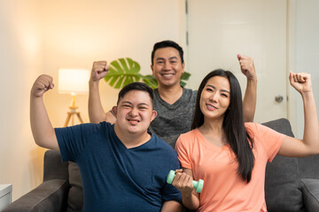 Portrait of happy Asian family exercising together for health care.