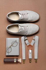 Male accessories and shoes on brown background