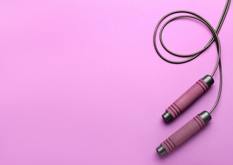 Skipping rope on color background