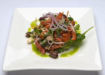 Greek salad with spinach, tomato, olives, fetta, baby spinach and red onion