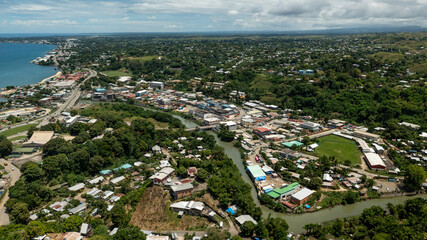 Fototapeta na wymiar Winding river separating China Town, Honiara city and suburbia.