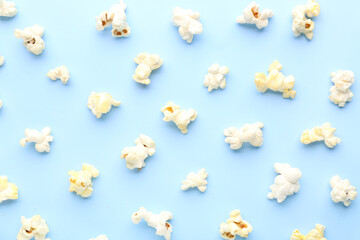 Delicious popcorn on blue background